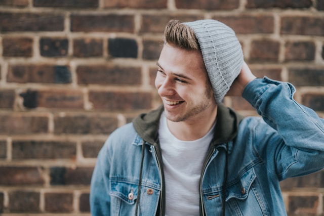 photo of a smiling teenage boy wearing a beanie